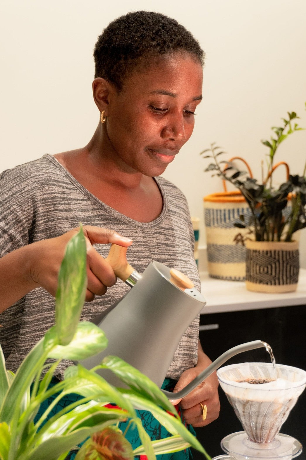 woman brewing pourover coffee